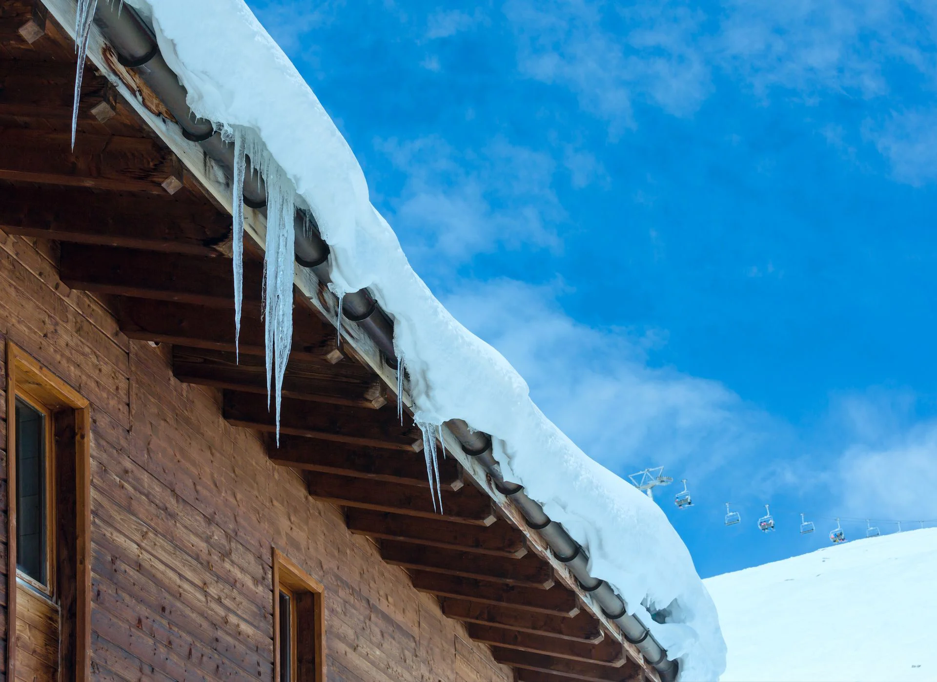 Wooden roof with icycles on it